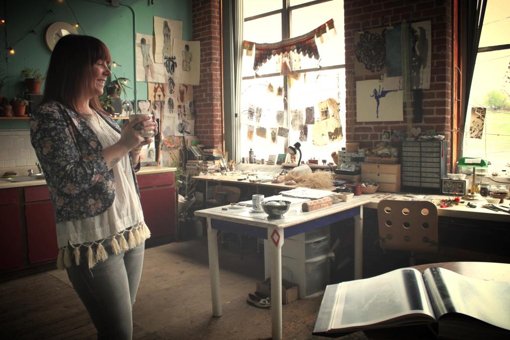 Islay Taylor standing in her jewelry studio.